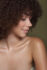 beauty and boudoir photography portrait ofof black girl with curly natural hair